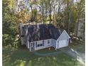 Aerial view of a single-story home with a yard at 5019 Poplar Glen Dr, Matthews, NC 28104
