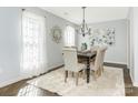 Elegant dining room featuring hardwood floors and chandelier at 8002 Regent Park Ln, Charlotte, NC 28210