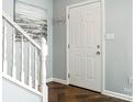 Bright entryway with staircase and hardwood floors at 8002 Regent Park Ln, Charlotte, NC 28210