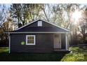 Front view of a charming gray house with white trim and a small porch at 340 E Torbush St, East Spencer, NC 28144