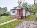 Renovated ranch home, white siding, red door, and landscaping at 41 Calhoun St, Great Falls, SC 29055