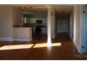 Updated kitchen with white cabinets, granite countertops, and stainless steel appliances at 7318 Old Mt Holly Rd, Charlotte, NC 28214