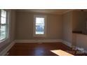 Bright living room featuring hardwood floors and large windows at 7318 Old Mt Holly Rd, Charlotte, NC 28214