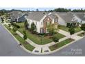 Two-story house situated on a corner lot with a spacious yard at 13929 Tilesford Ln, Huntersville, NC 28078