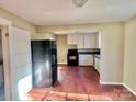 Simple kitchen with white cabinets, granite countertops, and dark wood floors at 722 Tanglewood Dr, Salisbury, NC 28144