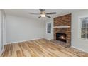 Living room with fireplace and light wood floors at 1744 Laurel Ln, Gastonia, NC 28054