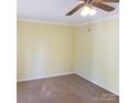 Bright bedroom with neutral walls and carpeted floors at 441 Holly Cir, Mount Holly, NC 28120