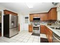 Kitchen with stainless steel appliances and wood cabinets at 1846 Colin Creek Ln, Charlotte, NC 28214