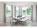 Bright dining room with large windows and wooden table at 2131 Endeavor Run, Charlotte, NC 28269