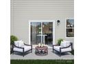 Cozy patio with two chairs and a round table at 2131 Endeavor Run, Charlotte, NC 28269