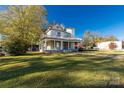 Victorian home with wrap-around porch at 307 Kings Mountain St, Clover, SC 29710