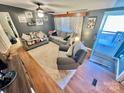 Bright living room featuring hardwood floors and ample seating at 940 Devil Track Rd, Taylorsville, NC 28681