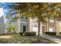 Two-story townhome with attached garage and stone accents at 9036 Bradstreet Commons Way, Charlotte, NC 28215