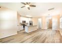 Open kitchen features granite countertops, stainless steel appliances, and an island at 9036 Bradstreet Commons Way, Charlotte, NC 28215
