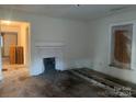 Living room with fireplace and hardwood floors, ready for your personal touch at 495 Carver St, Kannapolis, NC 28083
