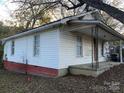 Side view of a small white house with a covered porch at 495 Carver St, Kannapolis, NC 28083