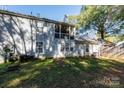Private backyard with screened porch and grassy area at 1541 Hunt Club Ct, Rock Hill, SC 29732