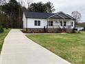 New construction home with concrete driveway and attractive landscaping at 3008 Forbes Rd, Gastonia, NC 28056