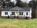 Charming new construction home with gray and white exterior and landscaped yard at 3008 Forbes Rd, Gastonia, NC 28056