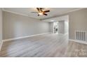 Spacious living room with light gray walls and wood-look floors at 1830 Ebenezer Rd, Rock Hill, SC 29732
