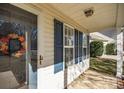 Inviting front porch with blue shutters and wreath at 2227 Oakhurst Ct, Kannapolis, NC 28081