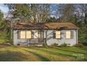 Charming one-story house with gray siding and a well-maintained lawn at 624 Dundeen Dr, Gastonia, NC 28052