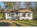 Cute ranch home with white brick exterior and a landscaped yard at 624 Dundeen Dr, Gastonia, NC 28052