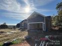Newly built home with gray siding and attached garage at 1517 Sugarfarm Rd, Catawba, NC 28609
