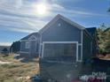 Newly built home with gray siding and attached garage at 1517 Sugarfarm Rd, Catawba, NC 28609