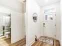 Light and airy entryway with hardwood floors and access to a full bathroom at 14421 Autumncrest Rd # 3, Huntersville, NC 28078
