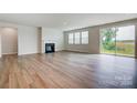 Gathering room with fireplace and sliding glass doors at 2525 Crimson Way, Monroe, NC 28112