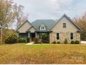 Two-story house with stone accents and a large front yard at 2818 Rockford Rd, Shelby, NC 28152