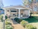 Charming house exterior with covered porch and well-manicured lawn at 7225 Hwy 73 E Hwy, Mount Pleasant, NC 28124