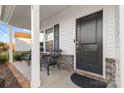 Front porch with brick flooring and wicker chairs at 113 Dublin Ct, Statesville, NC 28677