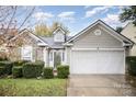 Front view of charming ranch home with double garage at 105 Ranlo Ave, Gastonia, NC 28054