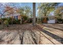 Brick ranch house with a large tree in the front yard at 325 W 13Th St, Salisbury, NC 28144