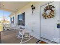 Relaxing front porch with rocking chair and swing at 508 White Dove Ct, Rock Hill, SC 29730