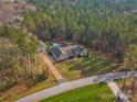 Property view showcasing home, pool, and surrounding woods at 700 Top Ridge Ln # 23, Clover, SC 29710