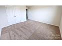 Spacious bedroom with carpet flooring and double door closet at 217 Aniston Ln, Shelby, NC 28152