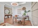 Light-filled home office with a wooden desk and comfortable chairs at 1037 Kinship Dr # 75, Lancaster, SC 29720