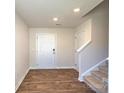 Bright and spacious entryway with stairs and hardwood floors at 12241 Lady Bell Dr, Charlotte, NC 28278