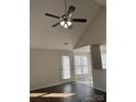 Hardwood floor living room with vaulted ceiling and access to back yard at 1415 Bells Knox Rd, Charlotte, NC 28214