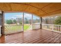 Spacious back porch with wooded views at 5112 Green Leaf Ct, Mount Holly, NC 28120