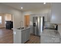 Modern kitchen with stainless steel appliances and island at 536 Fourth St # 9, Chester, SC 29706