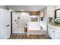 Bathroom with soaking tub, walk-in shower, and double vanity at 8024 Plymouth Dr, Sherrills Ford, NC 28673