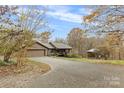House with long driveway and detached barn at 143 Ponokah Ln, Statesville, NC 28677