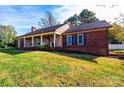 Ranch home with brick and wood siding at 6125 Gold Creek Estate Dr, Hickory, NC 28601