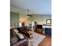 Open living room featuring hardwood floors and fireplace at 328 Holstein Dr, Dallas, NC 28034