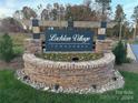 Community entrance sign for Lachlan Village Townhomes at 3339 48Th Ne Ave # 14B, Hickory, NC 28601