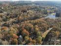 Aerial view showing home, lake, and surrounding landscape at 465 Lakedale Dr, Clover, SC 29710